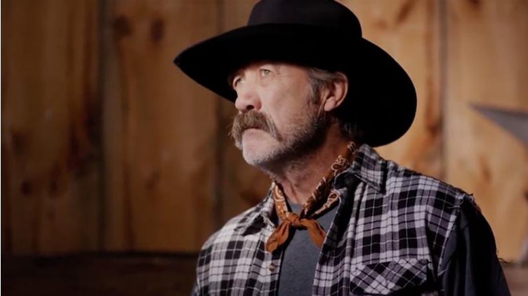 Father Willis, with his signature hat and weathered expression, embodies the strength of tradition on the ranch.